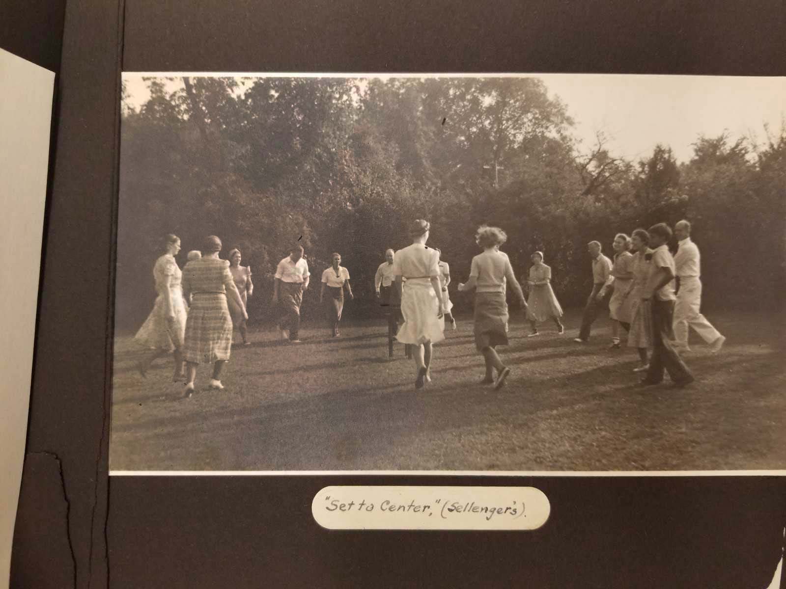 A sepia-toned archive photo of an outdoor dance