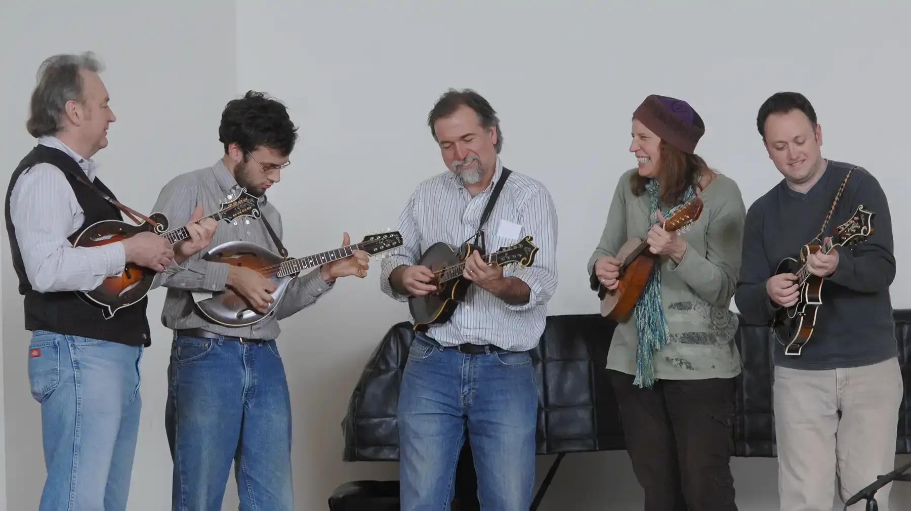 David Surette with two others, playing mandolin