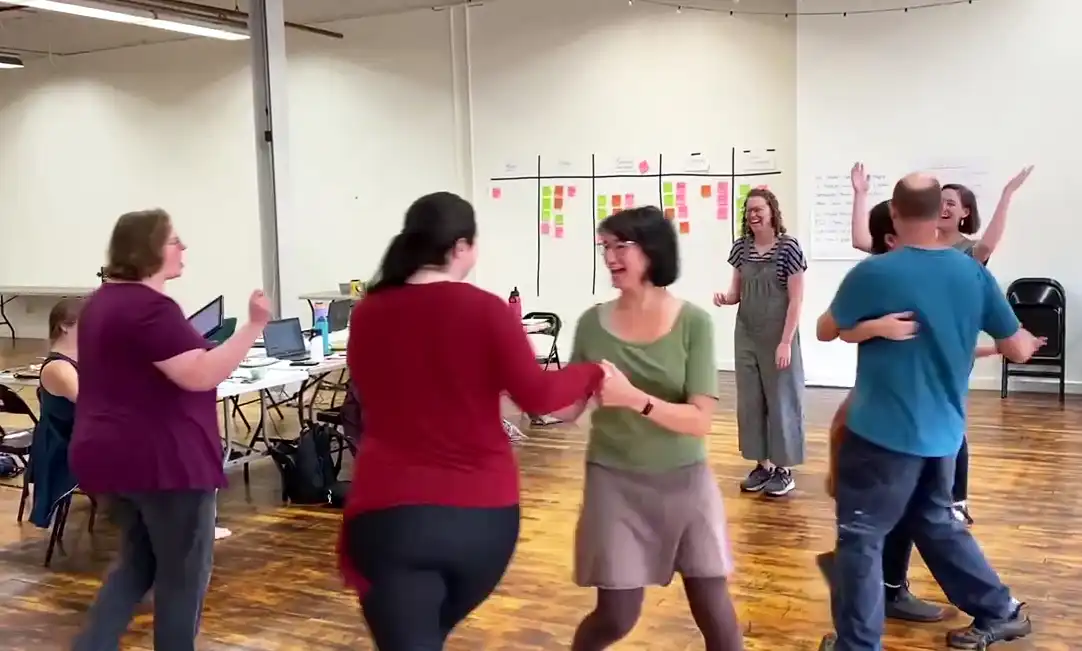 CDSS staff members dancing at a staff retreat