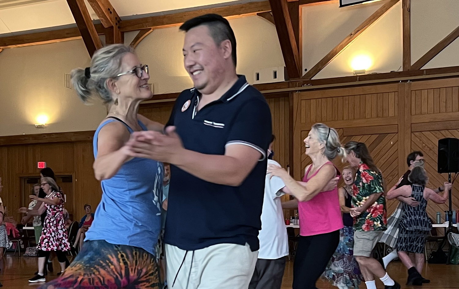 Two contra dancers mid-swing.