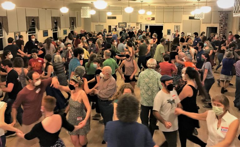 Dancers in masks at the Montpelier Contra Dance