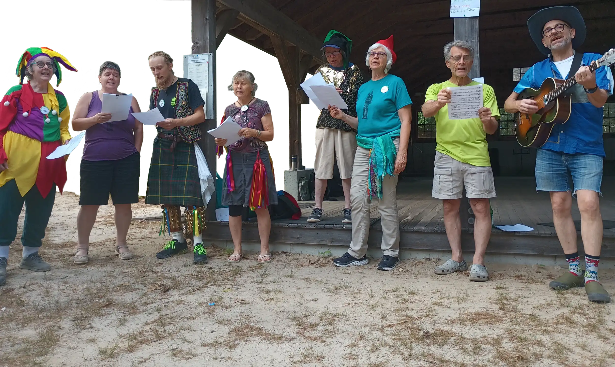 Campers singing outdoors in colorful outfits