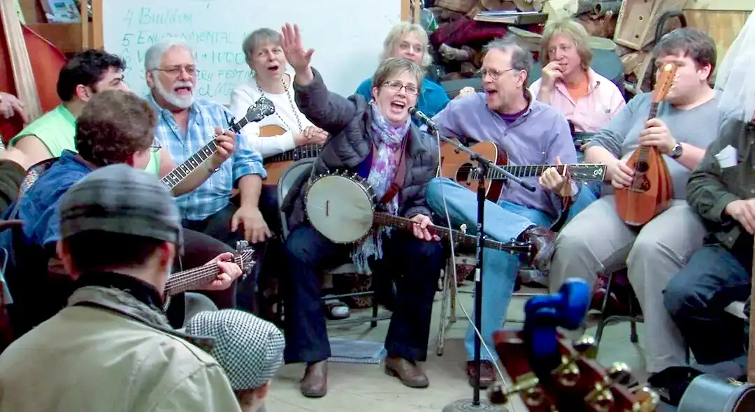 Still photo of folk singers from "We Began to Sing" by Polly Wells