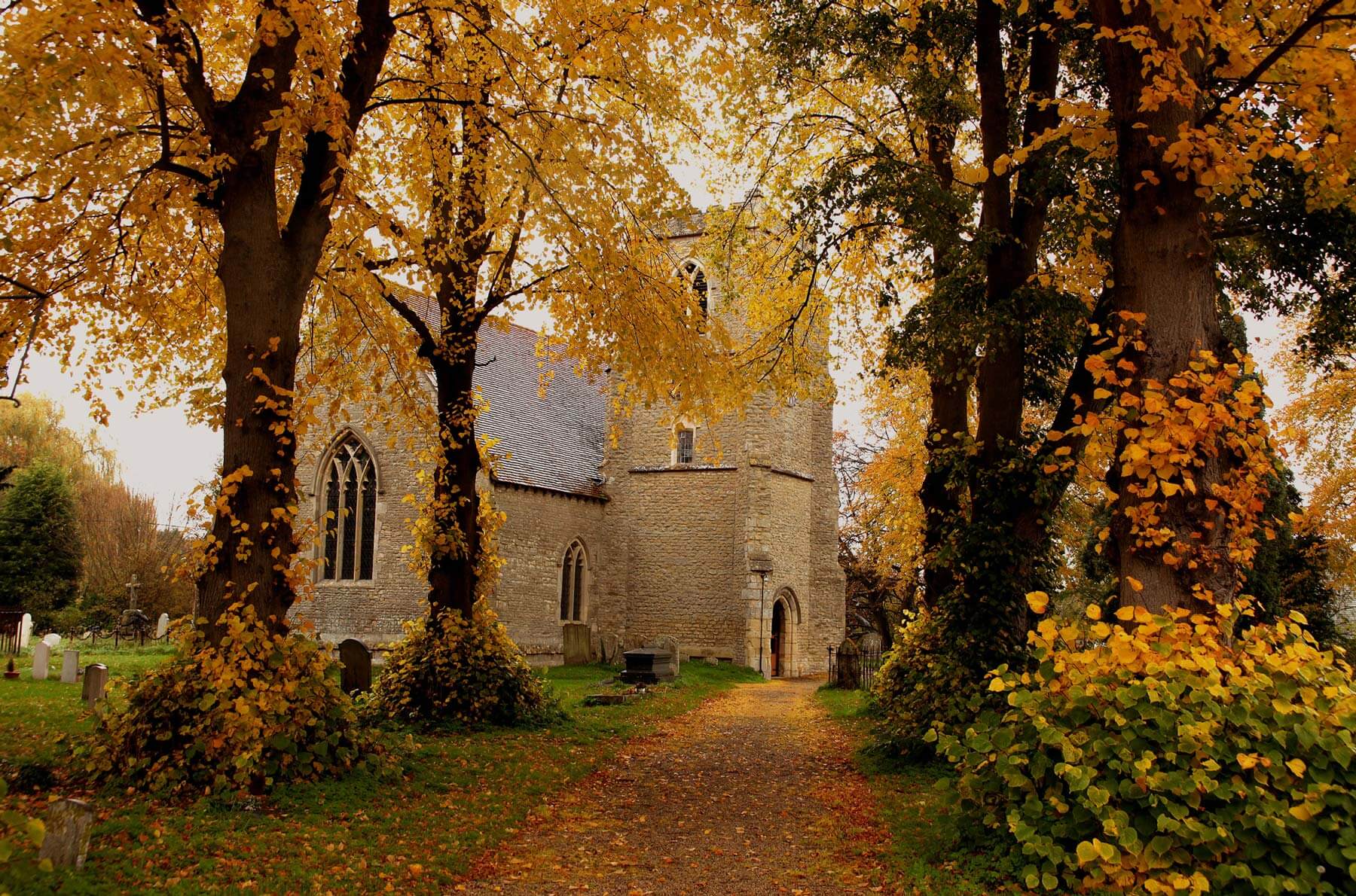 St. Catherine's Church in Towersey among autumn leaves
