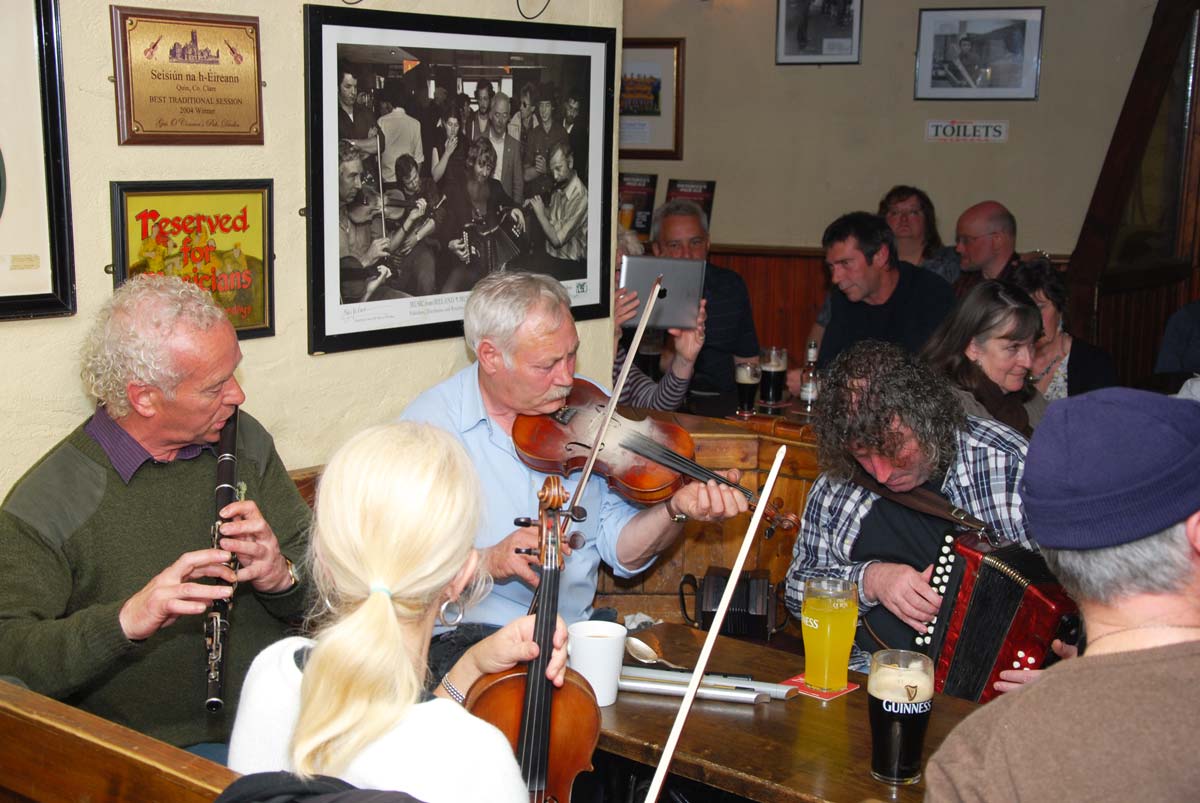 Traditional Irish musicians at a session in a pub